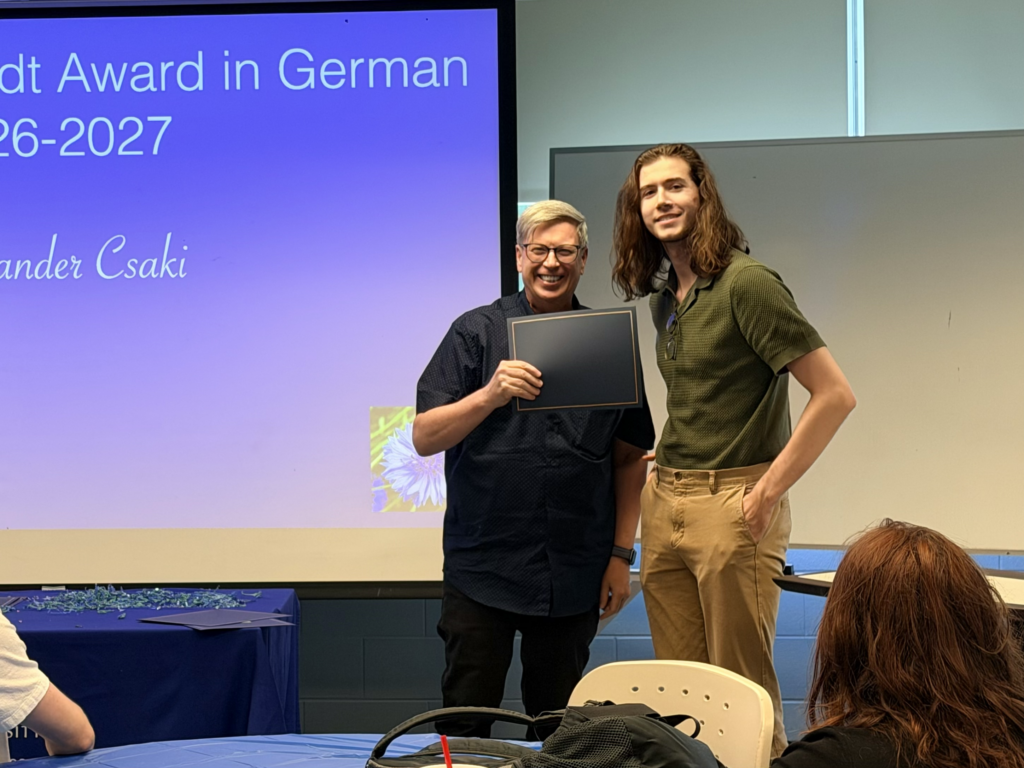 Faculty member standing with a student recipient of the Elizabeth Schardt Award in German.