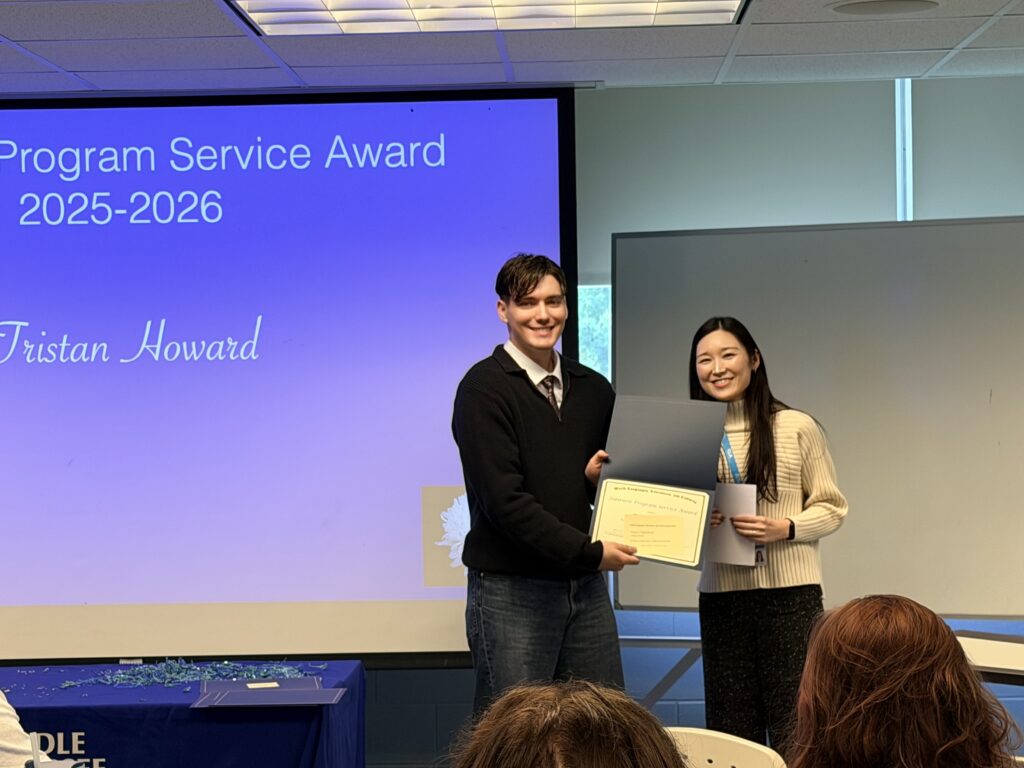 Student recipient of the Japanese Program Service Award posing with a faculty member.